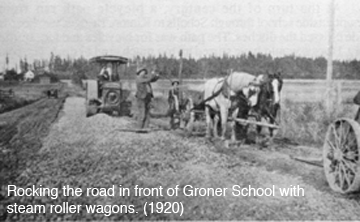 Rocking the road in front of Groner School with steam roller wagons (1920)